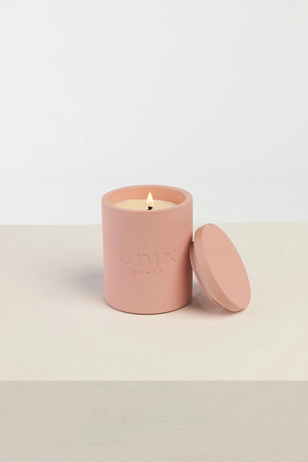 Powder pink sheer scented candle premium soy wax luxury - UNIX | شمعة سير معطرة بلون بينك باودر فاخرة من شمع الصويا الفاخر - UNIX