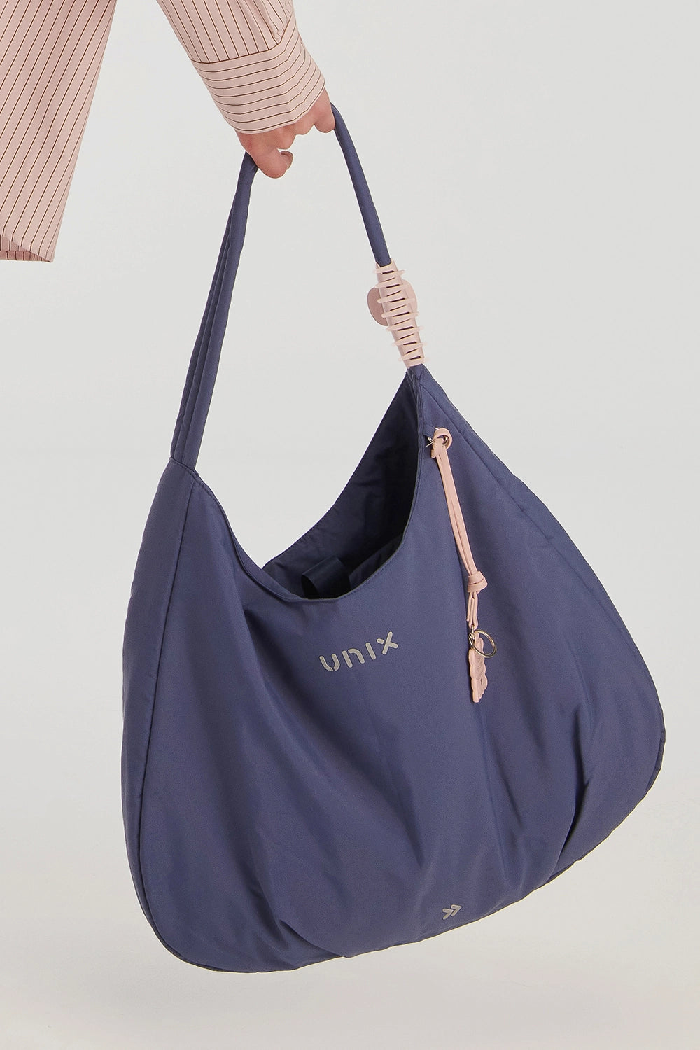 Timeless Gym Bag with Charm - شنطة جيم نسائية فاخرة باللون الكحلي مع تعليقة UNIX المميزة