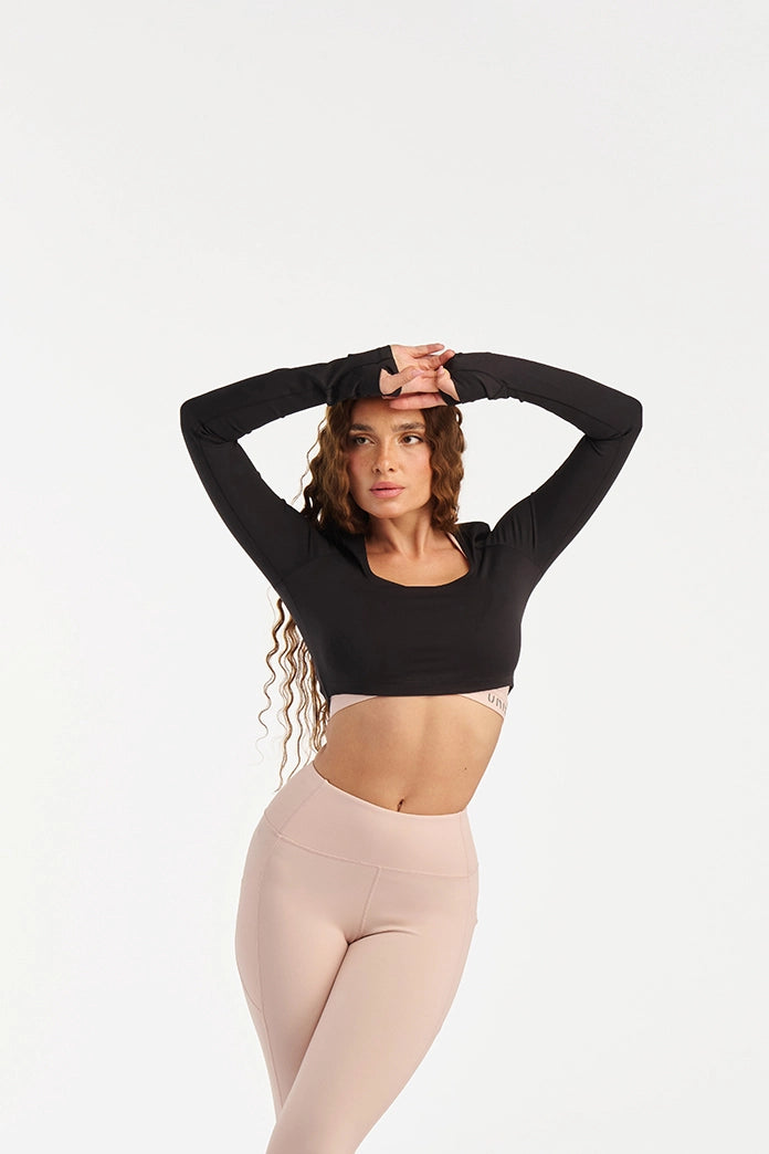 Black long sleeve top women front view scoop neckline activewear - UNIX | توب أكمام طويلة أسود نسائي من الأمام بياقة سكوب أكتيف وير راقي - UNIX