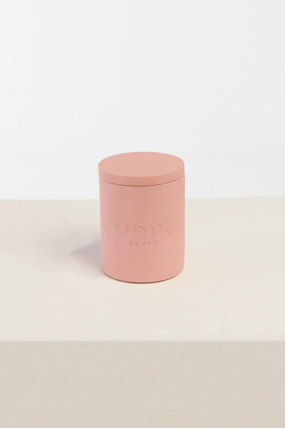 Powder pink candle lit ambient mood lifestyle home decor - UNIX | شمعة بينك باودر مشتعلة أجواء هادئة ديكور منزلي أنيق - UNIX