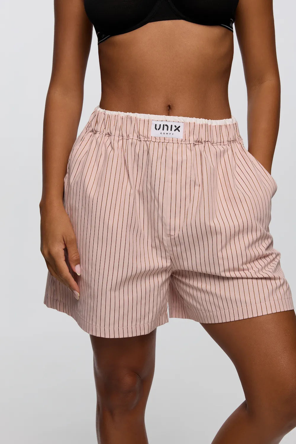 Women high waist striped lounge shorts detail elastic waistband - UNIX | شورت نسائي مخطط بخصر عالي وتفاصيل مطاطية مريحة تناسب الحركة اليومية