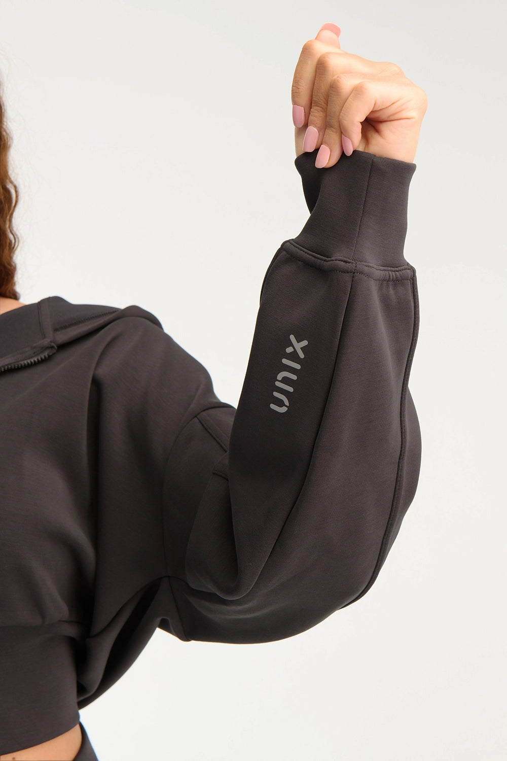 UNIX logo close up grey activewear fabric texture detail - UNIX | تفاصيل لوجو UNIX على قماش رمادي للأكتيف وير لقطة قريبة - UNIX