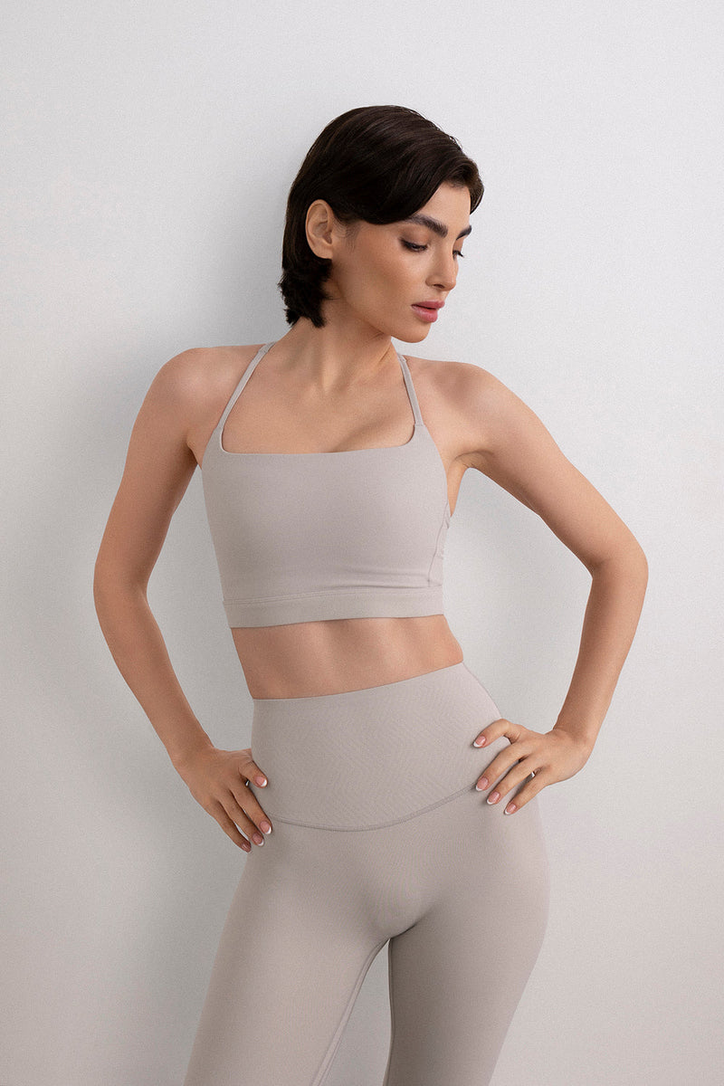 Cream bra top women front view sculpting feminine activewear - UNIX | توب برا كريمي نسائي من الأمام بقصة نحت أنثوية أكتيف وير راقي - UNIX