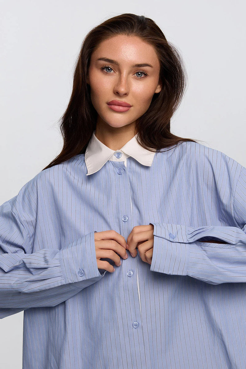 Women blue shirt collar detail close up clean tailoring - UNIX | تفاصيل ياقة قميص نسائي أزرق لقطة قريبة بتفصيل نظيف وأنيق - UNIX
