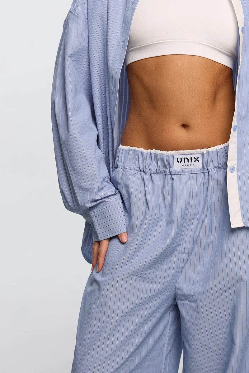 Light blue lounge pants women back view soft drape elegant - UNIX | بنطلون لاونج نسائي أزرق فاتح من الخلف بقماش انسيابي وأنيق - UNIX