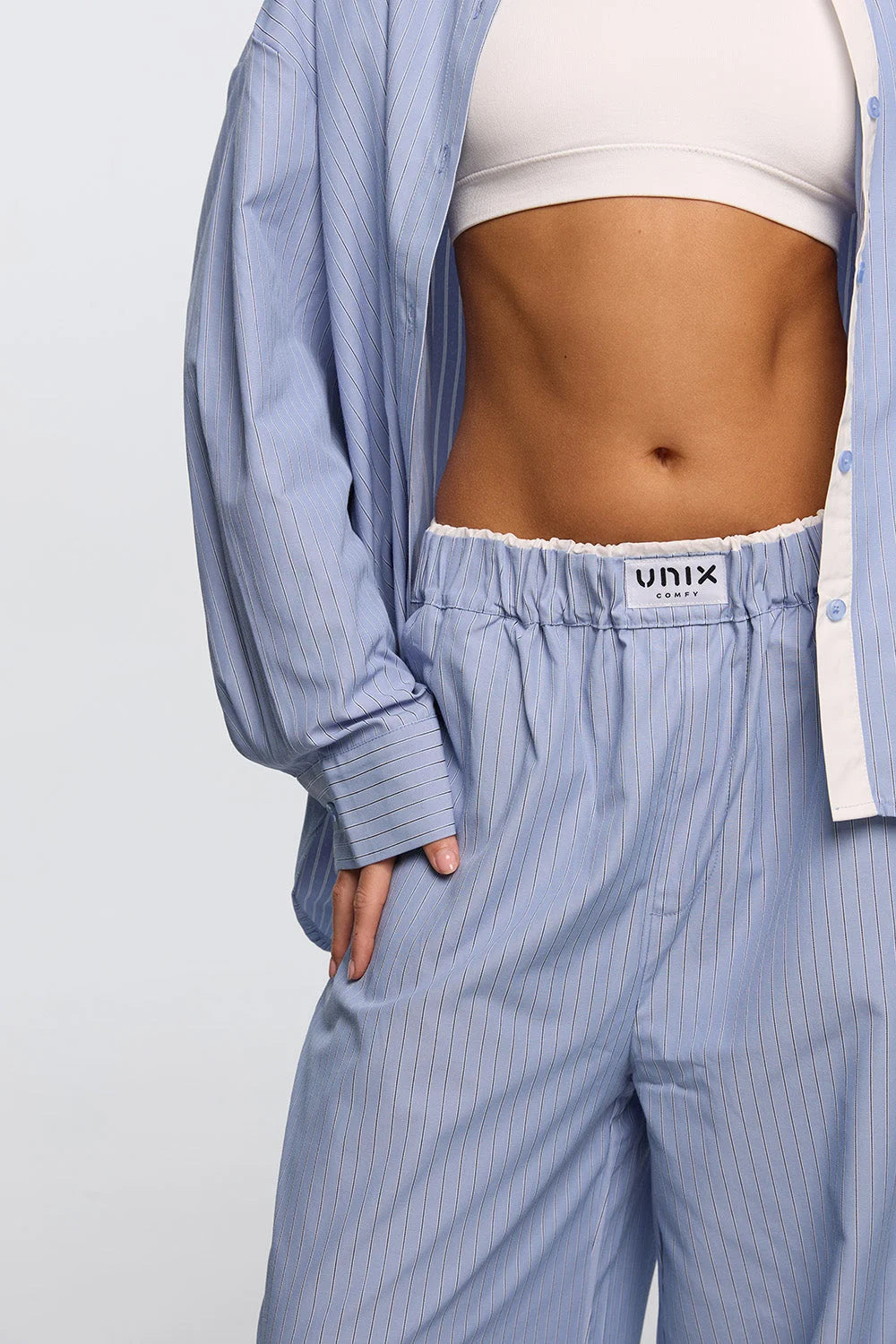 Women sky blue button up shirt front view minimal home wear - UNIX | قميص أزرار نسائي أزرق سماوي من الأمام إطلالة منزلية بسيطة - UNIX