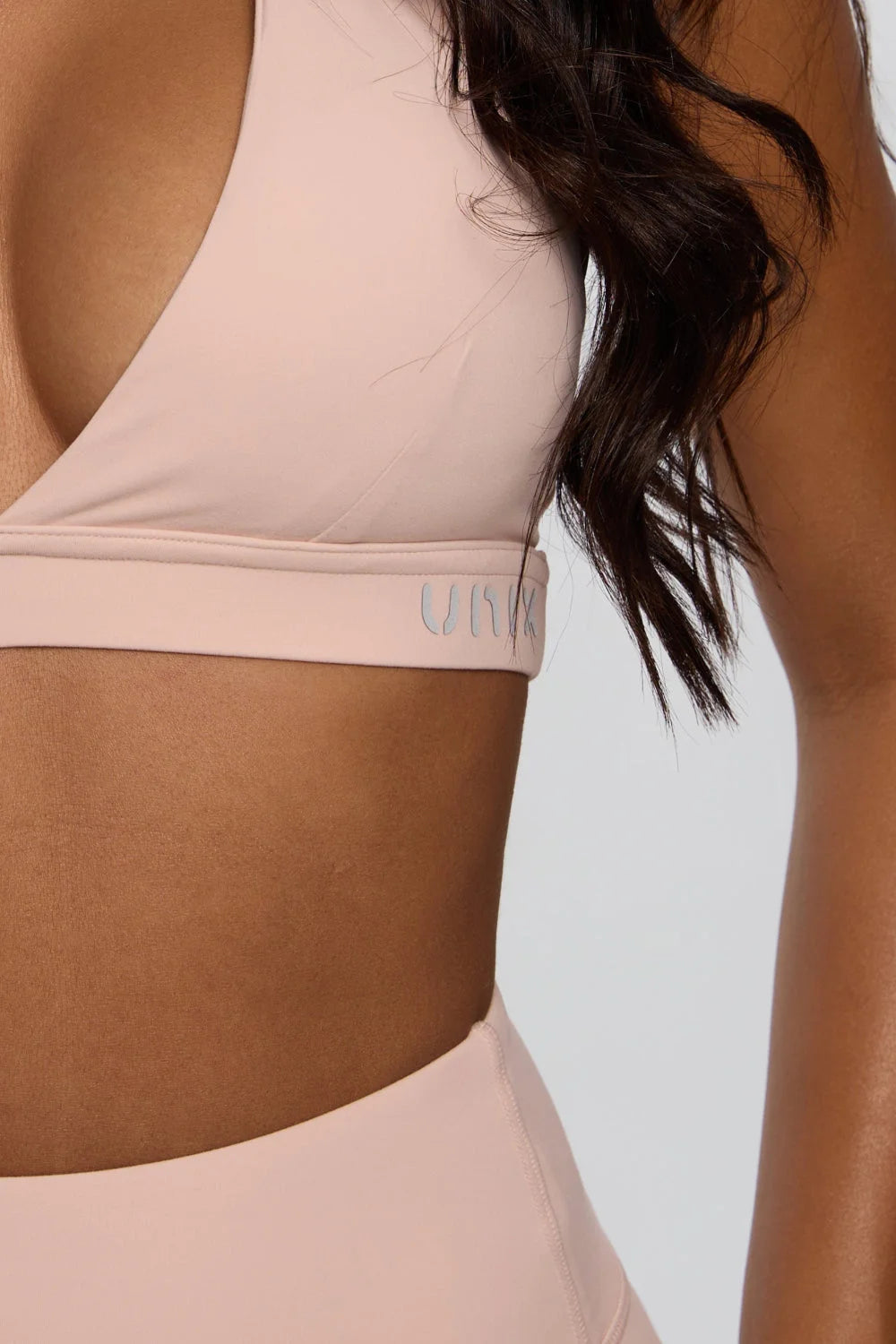 Pink curve enhance bra side view supportive feminine fit - UNIX | توب برا نسائي بينك من الجانب داعم وأنثوي بقصة تبرز القوام - UNIX