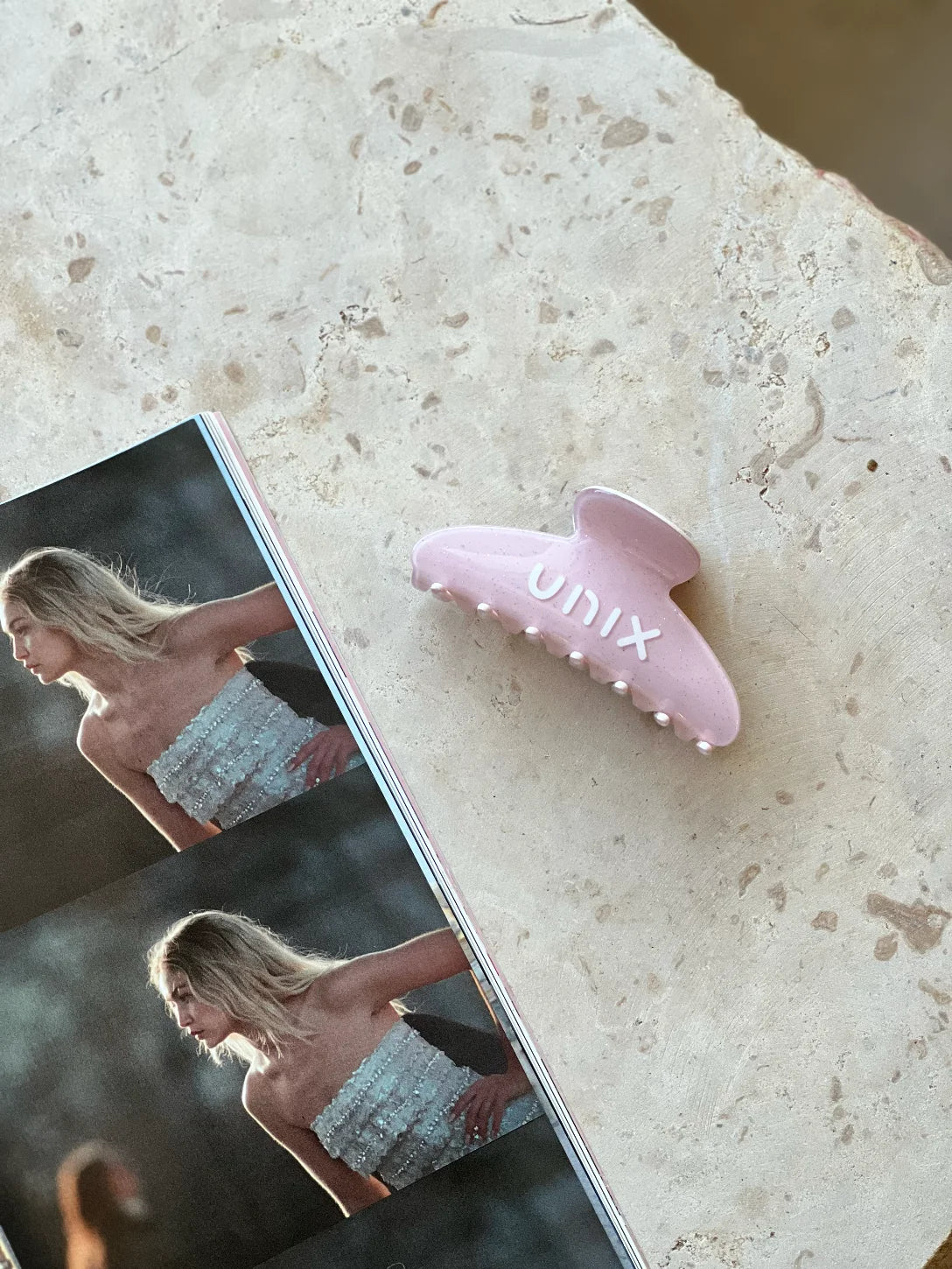 Pink hair clip styled product shot women lifestyle accessory - UNIX | لقطة منتج مشبك شعر بينك بأسلوب لايف ستايل إكسسوار نسائي - UNIX