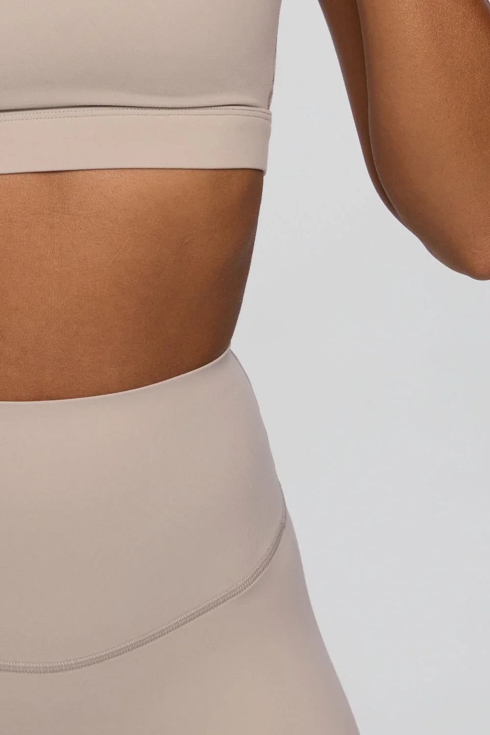 Cream bra top close up neckline detail premium UNIX activewear - UNIX | تفاصيل ياقة توب برا كريمي لقطة قريبة أكتيف وير UNIX فاخر - UNIX