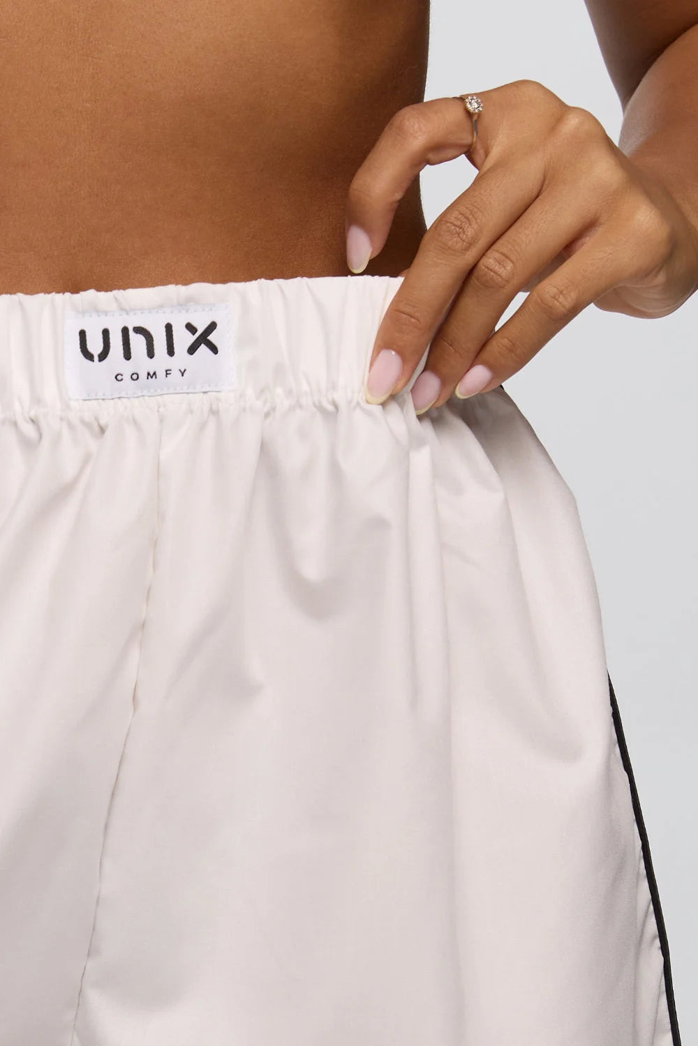 Women white home shorts relaxed fit lounge wear elegant style - UNIX | شورت نسائي أبيض للبيت بقصة مريحة لاونج وير بإطلالة راقية - UNIX