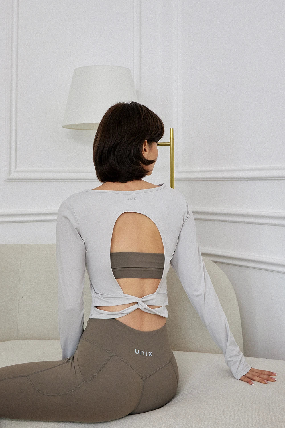 Twist sports top women silver - UNIX | توب تويست رياضي نسائي فضي بأكمام طويلة — UNIX
