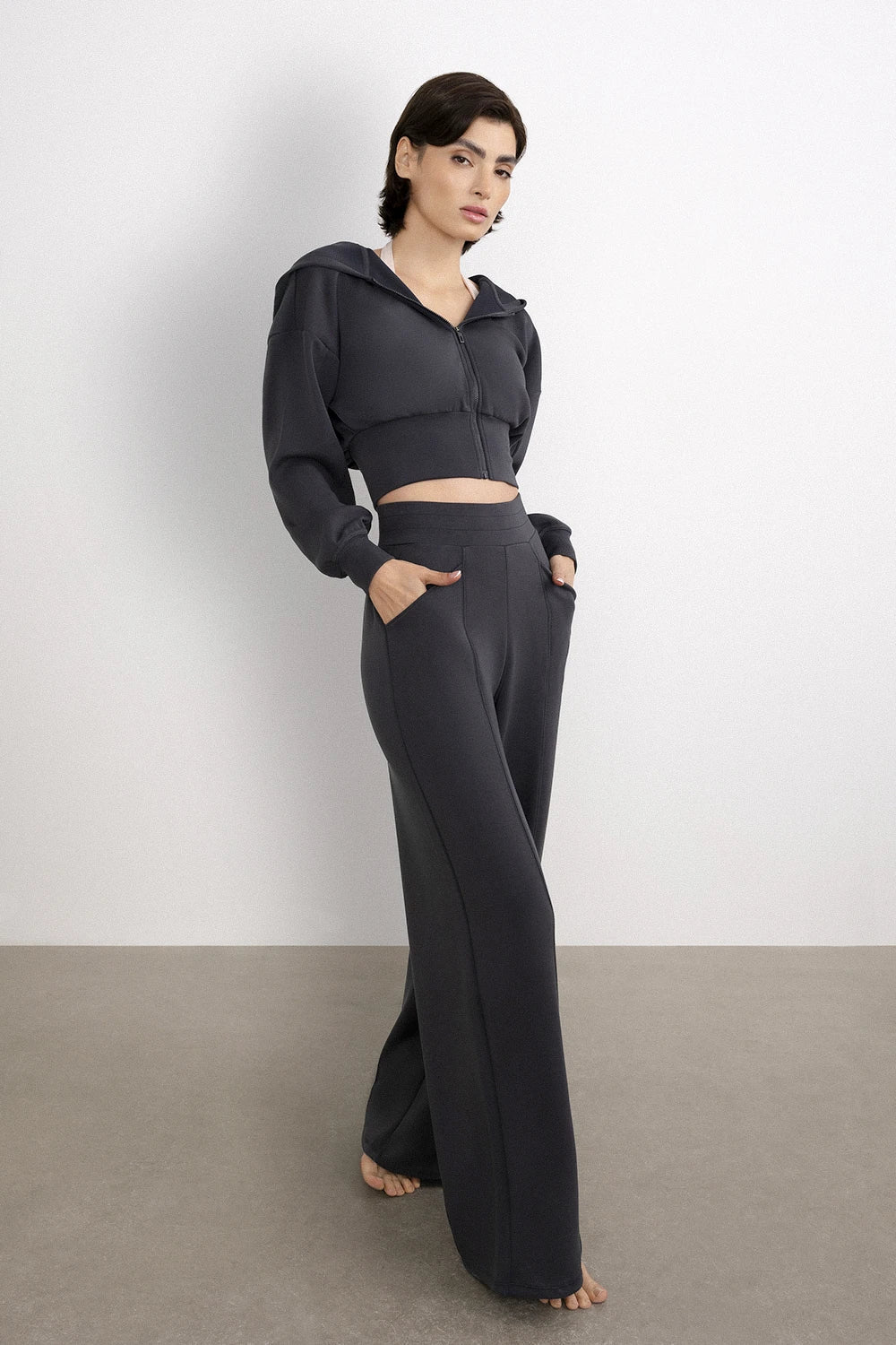 Women black wide leg pants front view minimal activewear look - UNIX | بنطلون نسائي أسود واسع بإطلالة أمامية بسيطة وعصرية للرياضة والحياة اليومية